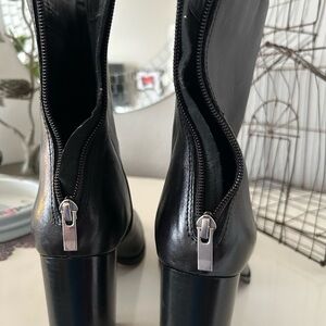 Sleek Black Leather Heeled Boots